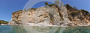 Rocky coast of Kastos island, Lefkada Regional unit, Ionian Islands, Greece in a summer sunny day.