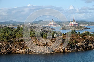 Rocky coast with offshore oil and gas pipeline rigs