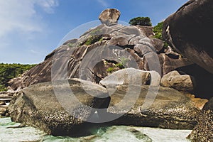 Rocky coast of paradise island with transparent crystal and clear water