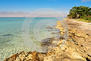 Rocky coast at playa Larga in Cuba photo
