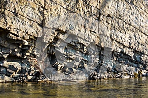 Rocky coast of the river. Landscape of countryside river