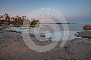 Rocky coast and sea. Finland, Scandinavian nature. Evening seascape, early spring, Long exposure