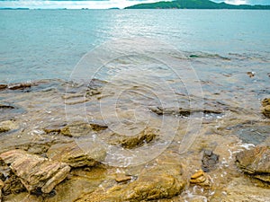 Rocky coast seascape in idylic ocean and View from the island photo