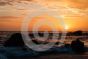 Rocky coast at sunset, at Wood`s Cove, in Laguna Beach, Orange County, California