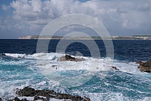 Rocky coastal inlet with breaking waves