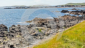 Rocky coastal shoreline at Inishbofin or White Cow Island with the horizon over the Atlantic Ocean photo