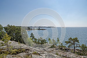 Rocky coastal view and Gulf of Finland, trees, shore and sea