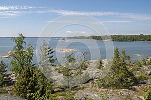 Rocky coastal view and Gulf of Finland, trees, shore and sea