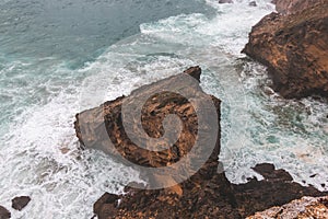 Rocky coastline of the Atlantic Ocean in the south-west of Portugal in the Algarve region. Exploring the beautiful rugged nature