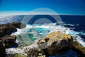 Rocky coastline cliffs near collapsed Azure window, Gozo island, Malta