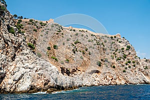 Rocky coastline Dil Varna Burnu cape of Alanya Promontorium in Turkey photo
