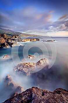 Rocky coastline and fog