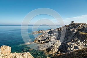 Rocky coastline and Genoese tower at Punta Spano in Corsica