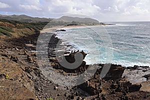 Rocky coastline with Halona Blowhole on the island of Oahu overlooking the Pacific Ocean