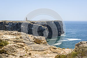 Rocky coastline and lighthouse in Sagres, Portugal