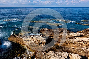Rocky coastline panorama with view over the sea to the horizon