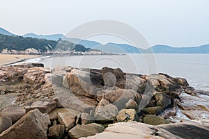 Rocky coastline and rocks and beach in the Putuoshan, Zhoushan Islands,  a renowned site in Chinese bodhimanda of the bodhisattva