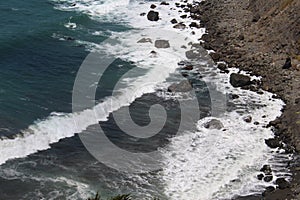 Rocky Coastline with Waves Rolling into the Shore