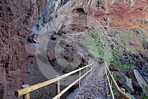 A rocky, colorful and volcanic hiking path leading to Playa de Nogales (Nogales beach)