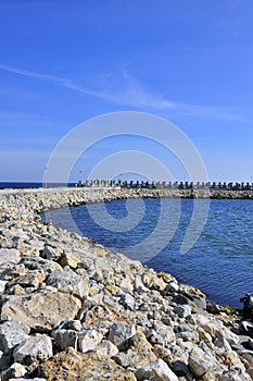 Rocky curved dam near black sea