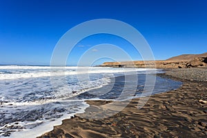 rocky escarpments on the south west coast of Fuerteventura photo