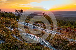 Rocky granite on top of the mountain at sunset