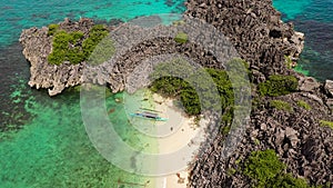 Rocky island with a small beach. Caramoan Islands, Matukad , Philippines.