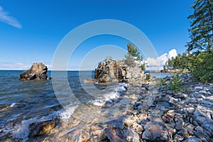 Rocky islands off the eastern coast of Lake Baikal in summer. The waters of the lake are restless. Buryatia, Russia