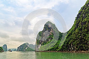 Rocky islets and green water in Halong bay