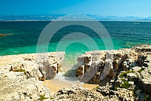 Rocky Kassiopi Beach, Corfu Island, Greece.