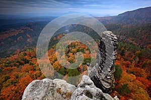 Rocky landscape during autumn. Beautiful landscape with stone, forest and fog. Sunset in Czech national park Ceske Svycarsko. Mist