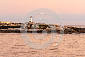 Rocky landscape on the ocean with a lighthouse