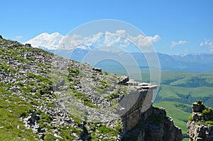 The rocky ledge on a background of mountain