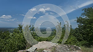 Rocky ledge with a blue sky view in the Ouachita Mountains