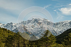 Snow capped peak of Paglia Orba in Corsica photo