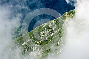 Rocky mountain landscape covered with clouds