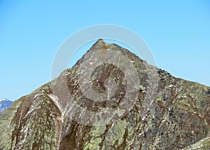 Rocky mountain peak Piz Murterchoembel (2998 m) in the massif of the Albula Alps above the Swiss road pass Fluela