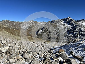 Rocky mountain peaks Piz Murterchombel (2998 m), Piz Arpschella (3031 m) and Piz Sarsura Pitschen