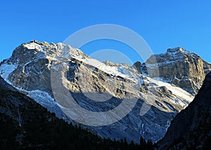 Rocky mountain peaks Plattenflue (3012 m) and Hoch Ducan or Piz Ducan (3063 m) in the Ducankette range