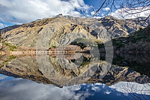 Rocky mountain range perfect reflection in Diamond Lake near Rocky Mountain