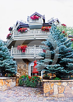 Rocky Mountain Ski resort in summer - Cute inn with flowers hanging from balconies and beautiful blue spruce