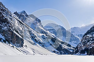 rocky mountains around frozen lake louise winter wonderland