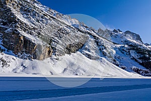 rocky mountains around frozen lake louise winter wonderland