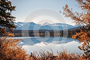 Rocky mountains with autumn leaves reflection in Pyramid lake at Jasper national park