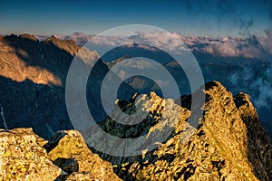 Rocky mountains with blue sky and beautiful clouds. Sunset over High Tatras mountains national park