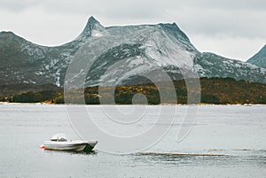 Rocky Mountains and fishing boat sea wild Landscape in Norway scandinavian