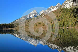 Rocky Mountains mirrored in String Lake, Grand Teton National Park, Wyoming