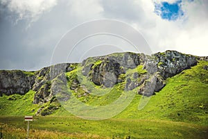 Rocky Mountains and route of touristic way sign landscape