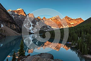 Rocky Mountains at sunrise - Moraine lake in Banff National Park of Canada