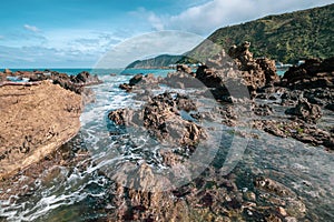 Rocky ocean coastline Island Bay, Wellington, New Zealand landscape taken with the wide angle